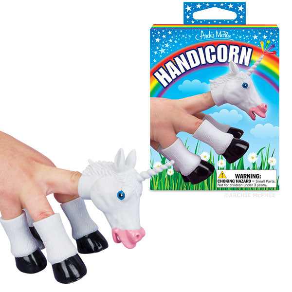 A hand displays the Handicorn set of finger puppets, highlighting the unicorn head puppet, with its packaging visible next to it.