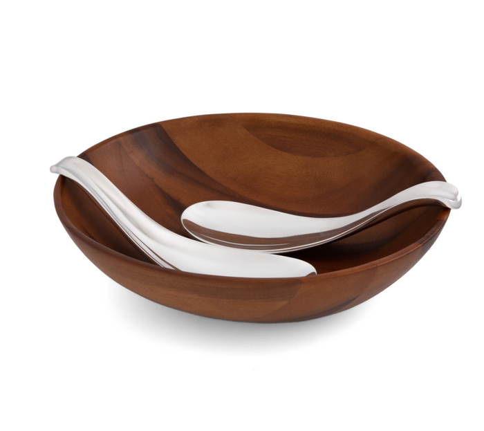 wooden serving bowl with metal ying yang style serving spoons.
