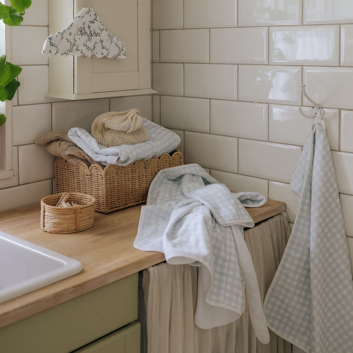 laundry room with baskets, towels.