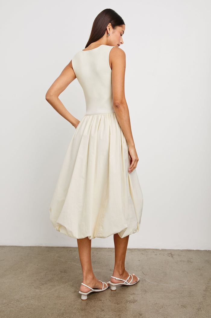 Rosalind tank midi dress with scoop neck, fitted bodice, and bubble skirt in Ivory - back view on model