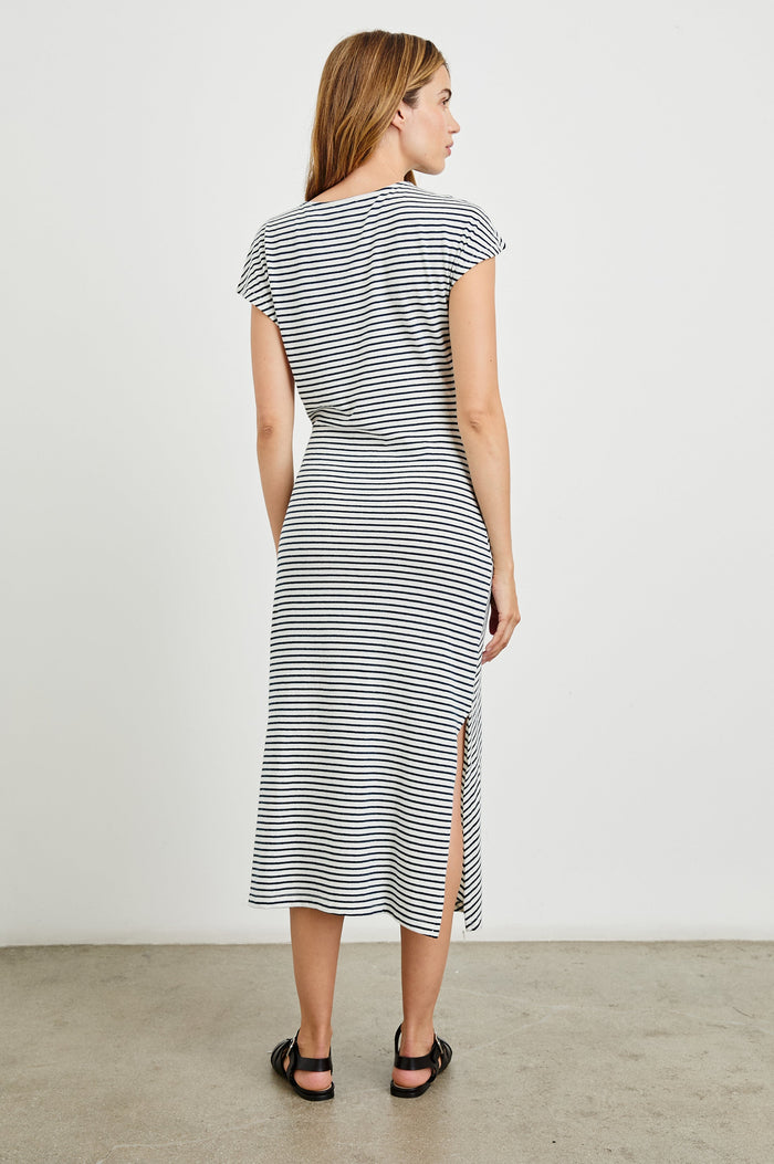 Selah Maxi Dress with Short Sleeves, Boatneck, Adjustable Side Tie at Waist and Two Mid-Calf Side Slits in Black Colorway - Back Full Body View Featured on Model