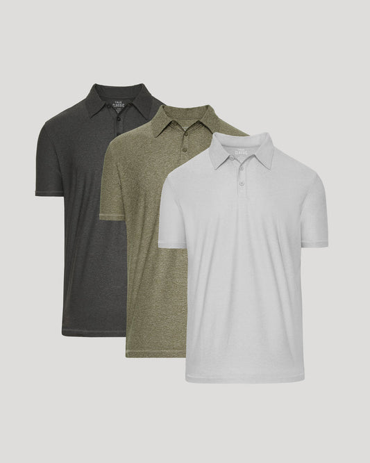 Three short-sleeve polo shirts in dark charcoal gray, olive green, and white, arranged in a staggered overlapping layout against a light gray background.