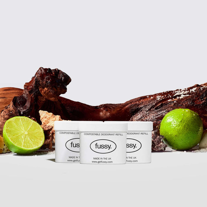 Fussy's All At Sea Refill Deodorant Pack - with three refills set against a backdrop of cedarwood, limes and sea shells.