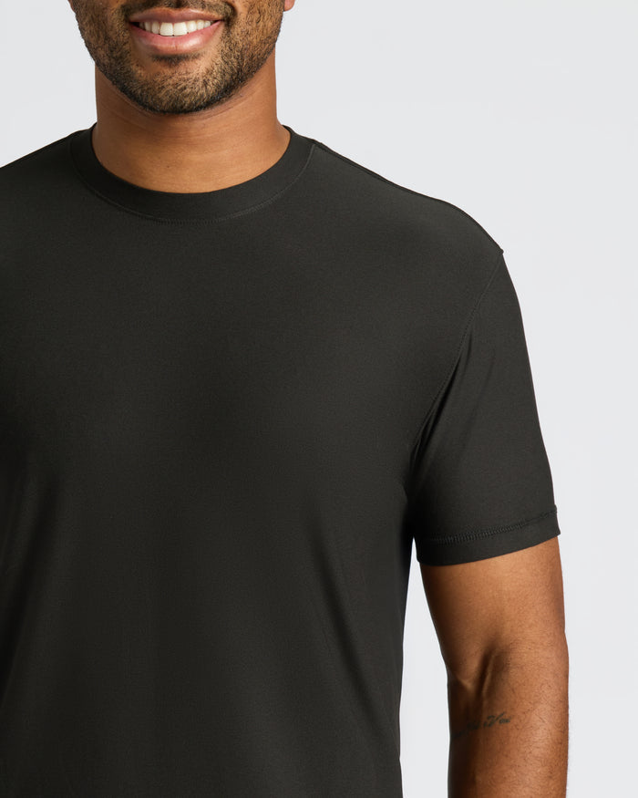 Man wearing Black Active Crew Neck Tee with visible tattoo on arm.