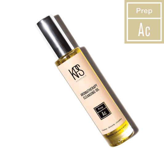 Bottle of Aromatherapy Cleansing Oil | Kindness Powered Skincare with a silver cap on a white background, highlighting its use for cleansing, detoxifying, and comforting the skin.