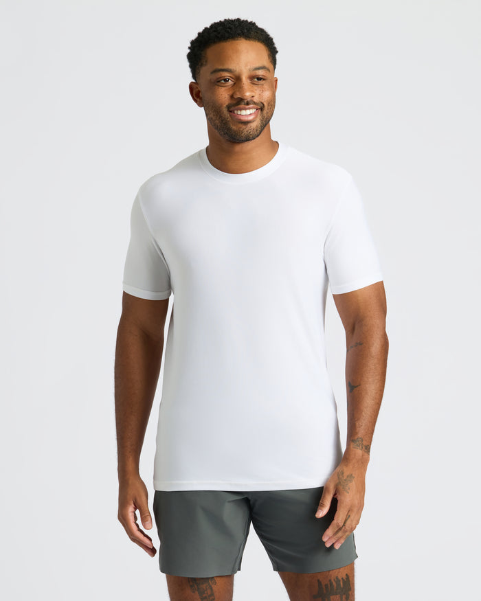 Man wearing Black Friday Activewear Doorbuster 6-Pack white crew-neck tee and dark shorts.