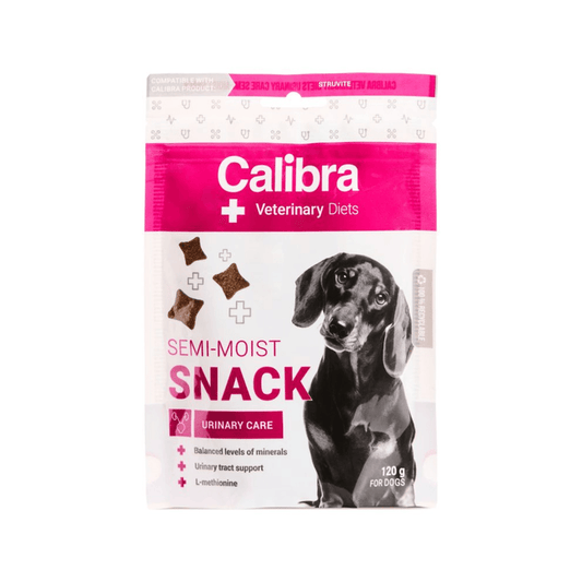 A package of Calibra Veterinary Diets Semi-Moist Snack for dogs, featuring a white and bright pink bag with a black dachshund illustration and product pieces shown on the front.
