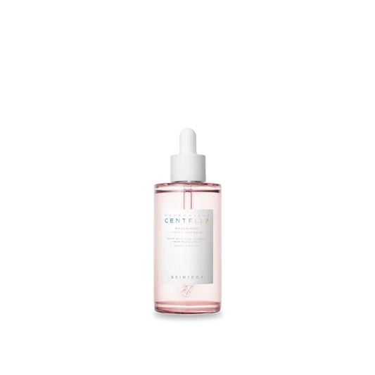 Skincare serum bottle with dropper on a white background