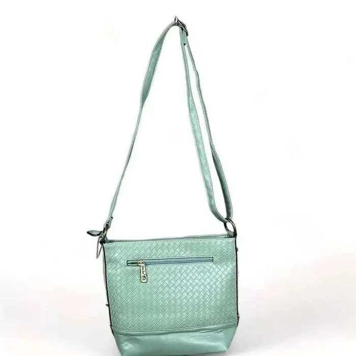 Cotton Road Sling Bag in green PU leather with weave effect and adjustable strap