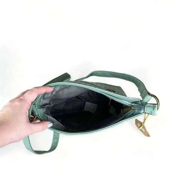 Cotton Road Sling Bag in green PU leather with weave effect and adjustable strap