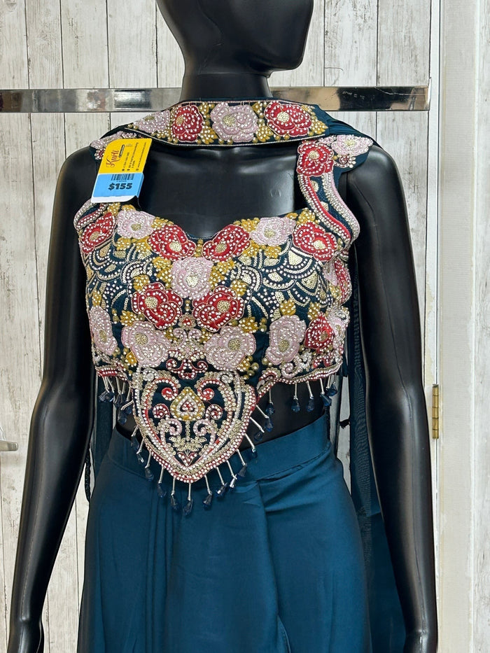 Kurti Connection USA teal crop top with intricate floral embroidery, beadwork, and fringe on a black mannequin