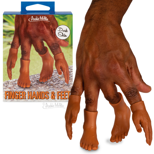 A hand displays the "Finger Hands & Feet - Dark Skin" finger puppets, complete with tiny hands and feet, alongside their product packaging. Crafted from soft vinyl, these one-of-a-kind accessories add a playful touch to any starter pack.