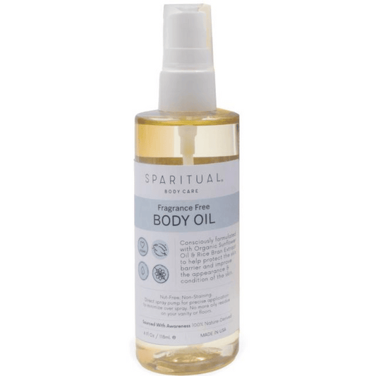 Clear bottle of Fragrance Free Body Oil | Sparitual with a white pump top, designed for gentle skincare and body care with organic sunflower oil and rice bran extract.
