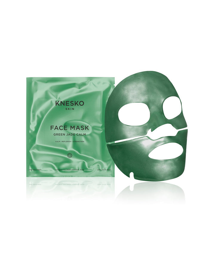 Green Jade Calm Face Mask | KNESKO with a smooth green jade-infused sheet mask next to its matching green satin packaging, designed for skincare and calming wellness rituals.