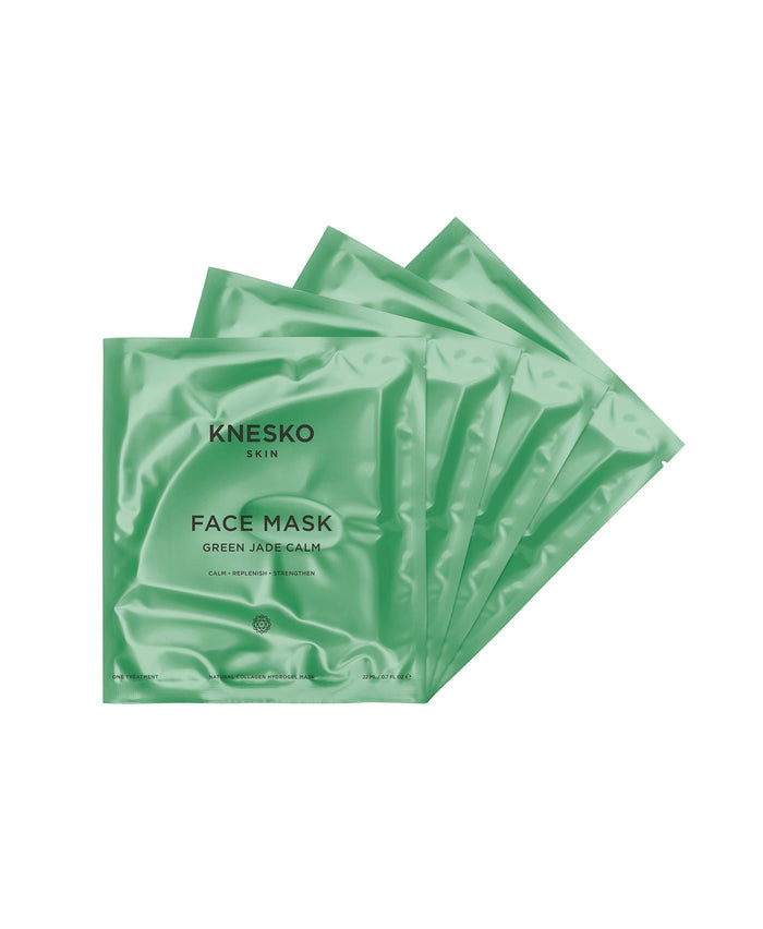 Five green sachets of Green Jade Calm Face Mask | KNESKO arranged in a fan shape, highlighting skincare packaging designed for calming and replenishing the skin.