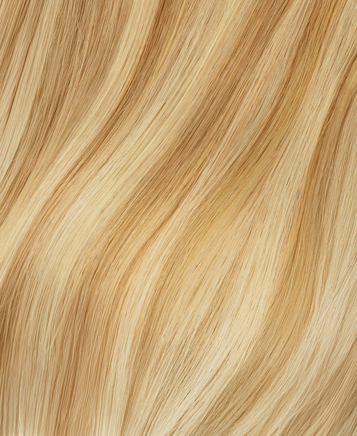 Close-up of wavy blonde hair extensions texture