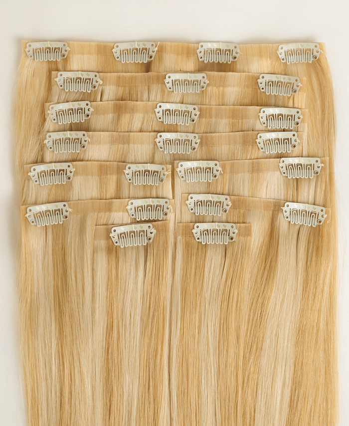 invisible clip-in hair extensions golden highlights.