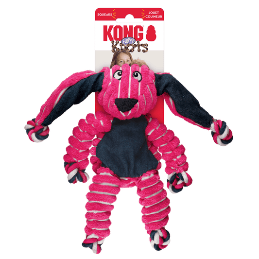 Pink and white stripy fabric Rabbit Dog Toy with dark blue fabric ears and belly attached to a cardboard backing, pictured on a white background.