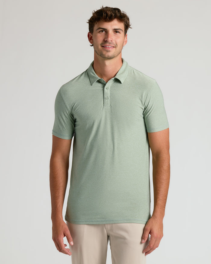 Young man wearing Lichen Short Sleeve Tall Active Polo.