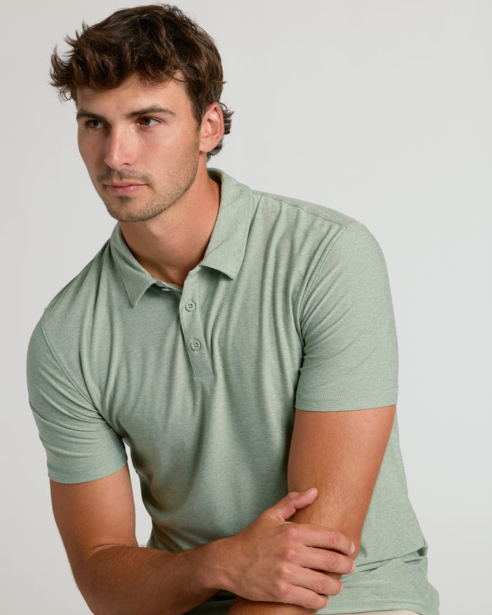 Young man wearing Lichen Short Sleeve Tall Active Polo.