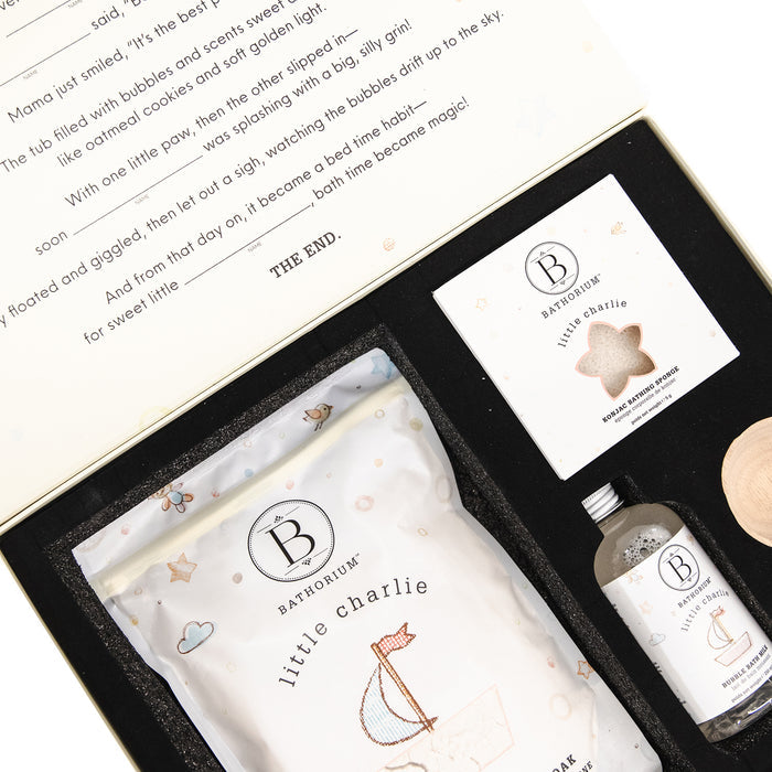 Gift box set featuring little charlie™ My First Bath Ritual Gift Box Set | Bathorium with bath soak, chewable bath bomb, and serene chew for a gentle, soothing bath experience.