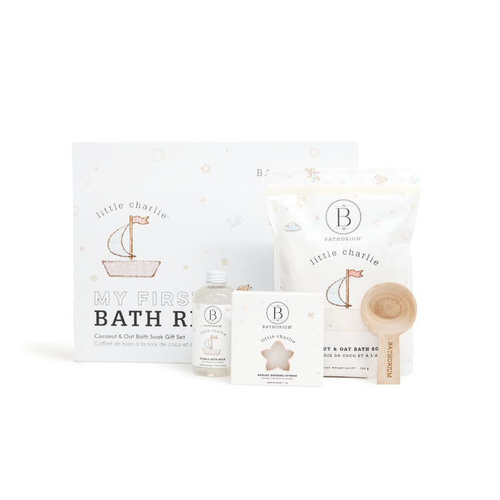 little charlie™ My First Bath Ritual Gift Box Set | Bathorium featuring coconut and oat bath soak with a wooden scoop, bath oil, and soap in a white decorative box for gentle skincare and wellness.