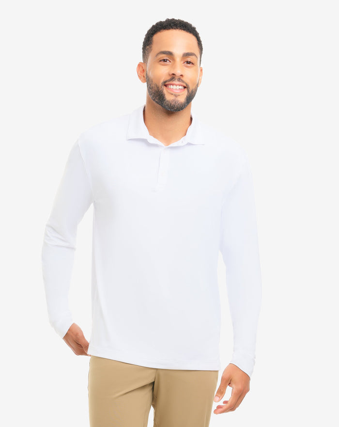Man wearing a white long-sleeve shirt and beige pants on a white background