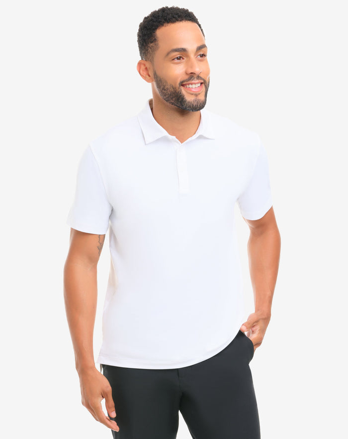Man wearing a white polo shirt and black pants on a white background