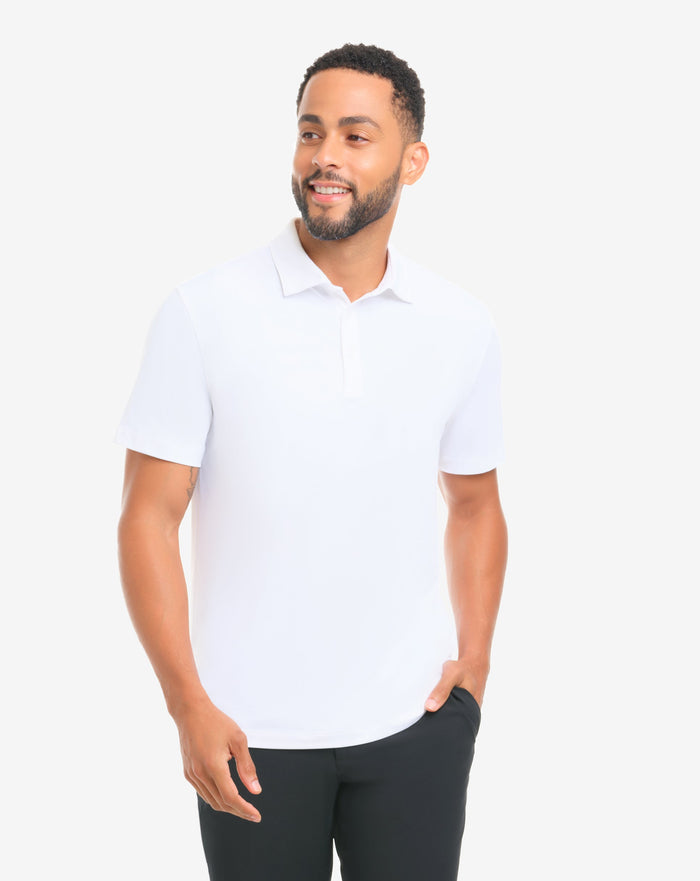 Man wearing a white polo shirt and black pants on a white background