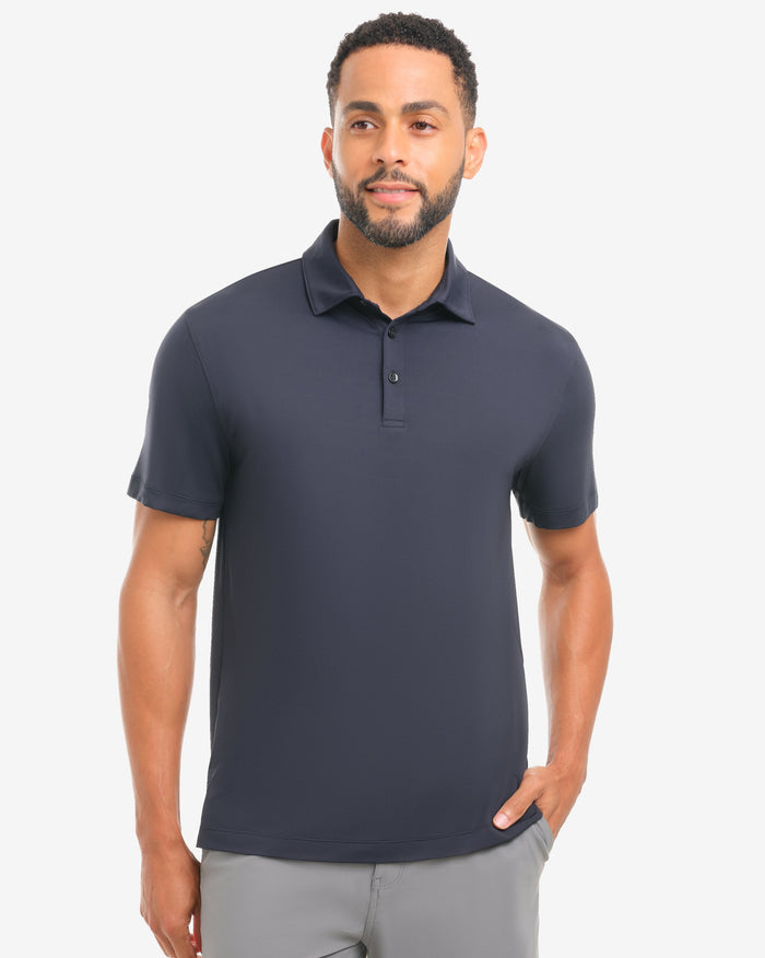 Man wearing a black polo shirt against a white background