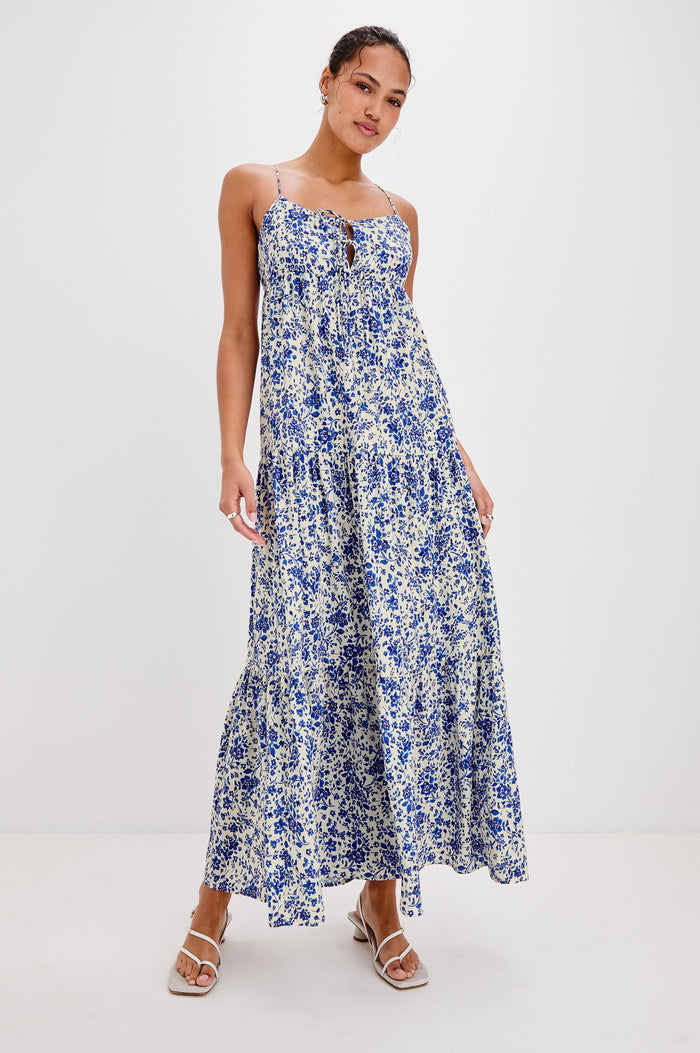 Mica Midi Tank Dress with and Empire Waist, Spaghetti Straps, a Keyhole at Center Front, Ties and a Tiered Skirt in Blue Marguerite Colorway. Front View Shown on Model.