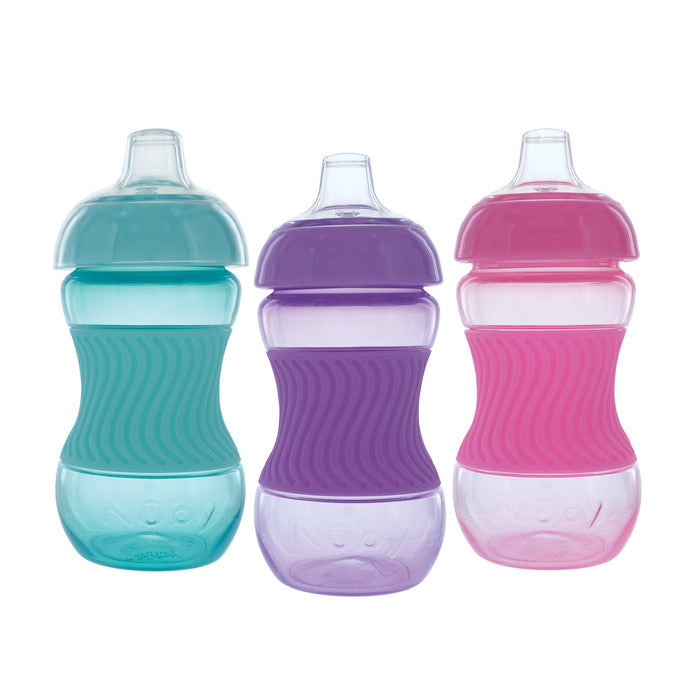 The Mini Gripper Soft Spout Sippy Cup with Sleeve (3 Pack) includes teal cups with green, purple, and pink silicone grips. Each leakproof cup has a soft spout and curved design for easy holding by little hands.