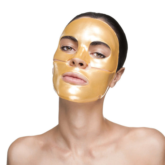 Woman wearing a glowing golden face mask on her skin, showcasing the Nanogold Repair Face Mask - Single | Knesko for skincare and wellness.