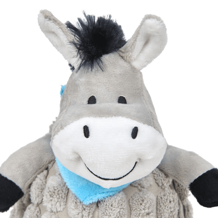 Close up of grey donkey dog toy face with back mane and hoofs wearing a blue neckerchief sat on a white background.