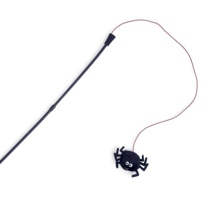 Black spider cat toy on a fishing-style rod with stitched eye and smile details. On a white background.