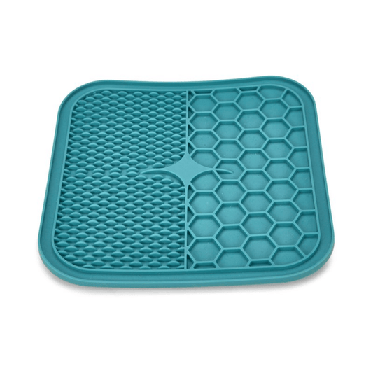 Blue silicone lick mat with two different textures, one with hexagon shapes, the other with small close together ridges pictured on a white background.