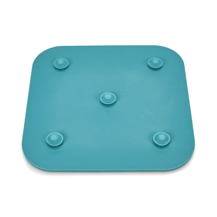 Back view of blue silicone lick mat, showing the five suction cups on the base pictured on a white background.