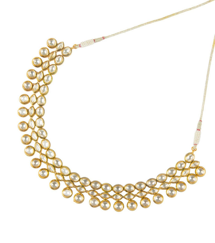 Layered gold-tone kundan collar necklace with round pearl-like discs along the neckline