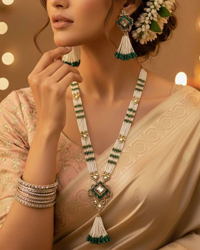 Multi-strand pearl necklace set with green tassels and square kundan pendants