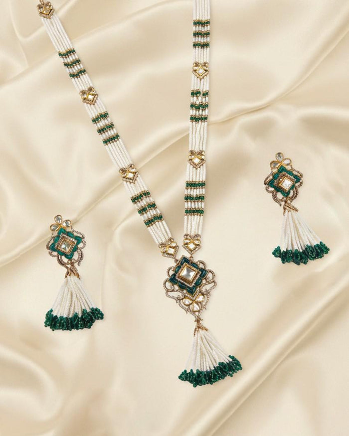 Beaded pearl necklace set with green-and-white tassels and square kundan elements