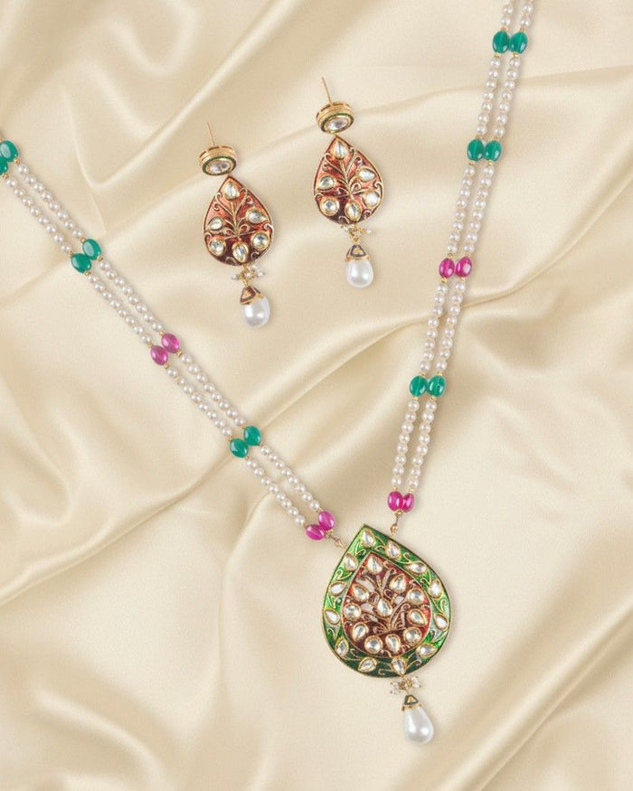 Kundan pendant set on pearl strings: green and pink teardrop necklace with pearl earrings
