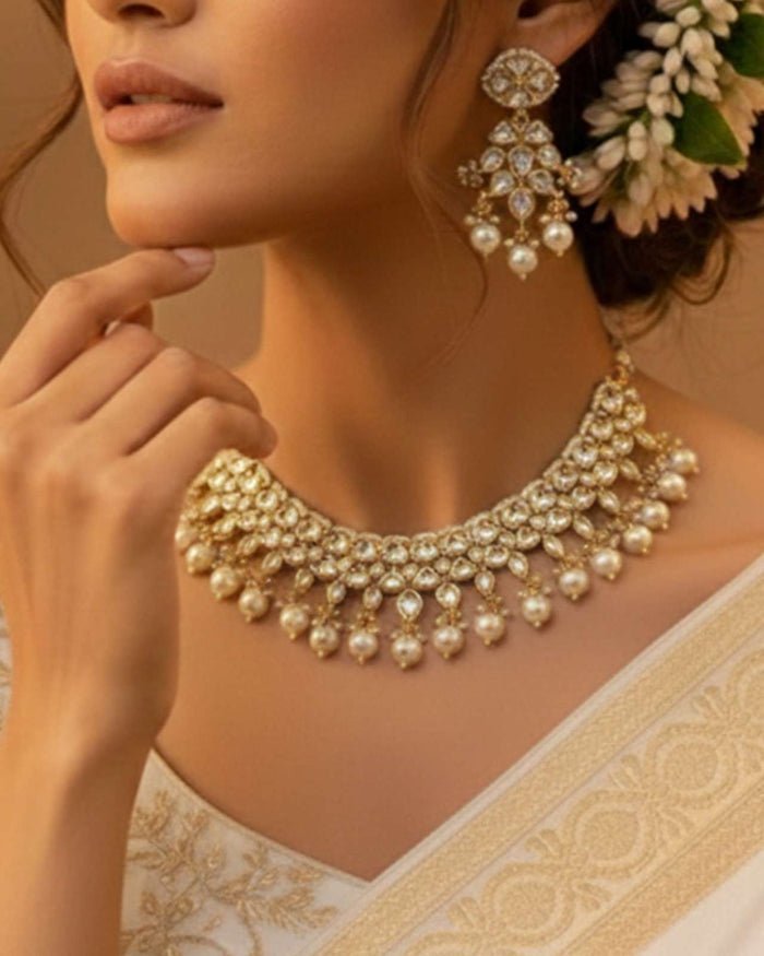 Gold and ivory kundan necklace with pearl drops and scalloped chandelier fringe