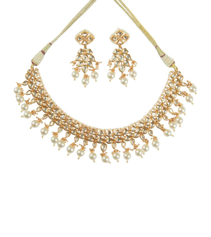Gold kundan necklace with pearl bead fringe and matching pearl drop earrings