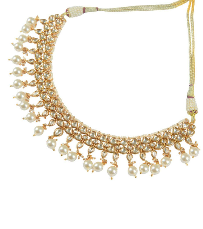 Gold kundan necklace with dense pearl fringe and adjustable cord ties