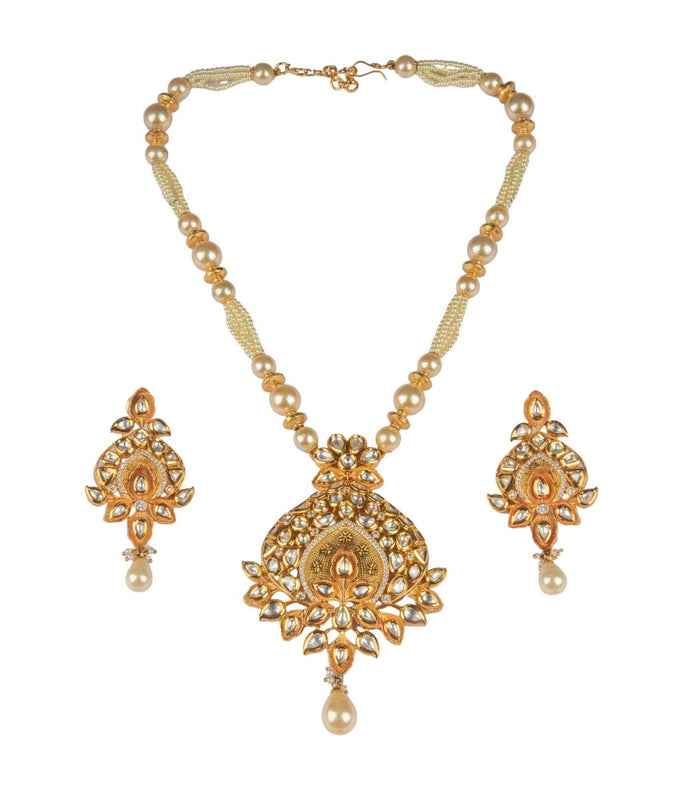 Kundan pendant necklace with pearl chain, gold-toned pendant, and two dangling pearl earrings