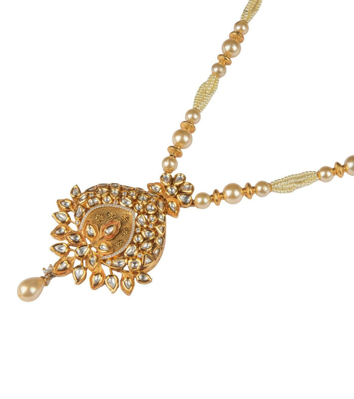 Kundan pearl pendant with ornate gold-toned detailing and a single pearl drop on a beaded chain
