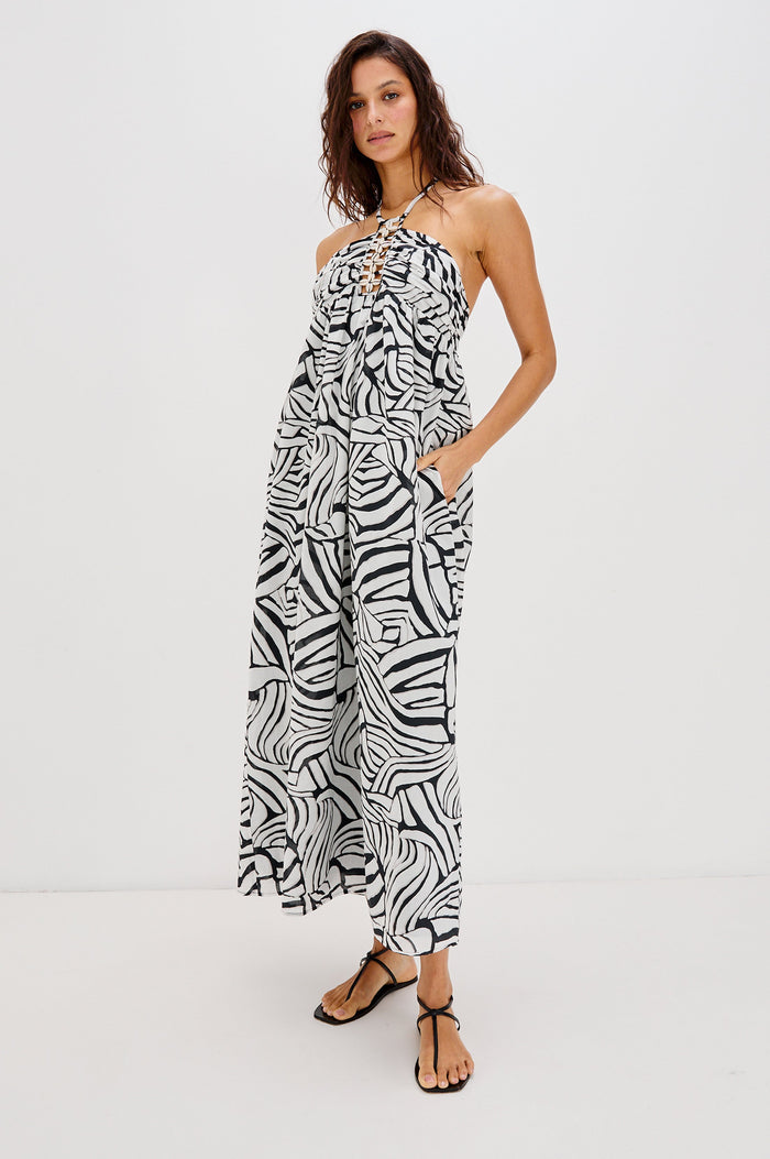 Palazzo Halter Midi Length Dress with Tie Neck and Sea Shell Lattice Detail at Center Front in White and Black Abstract Playa Blanco Colorway. Full Body Front View Shown on Model.