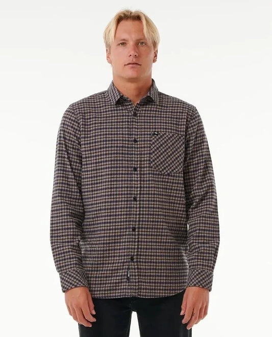 Man wearing a rip curl classic surf flannel plaid shirt on a white background