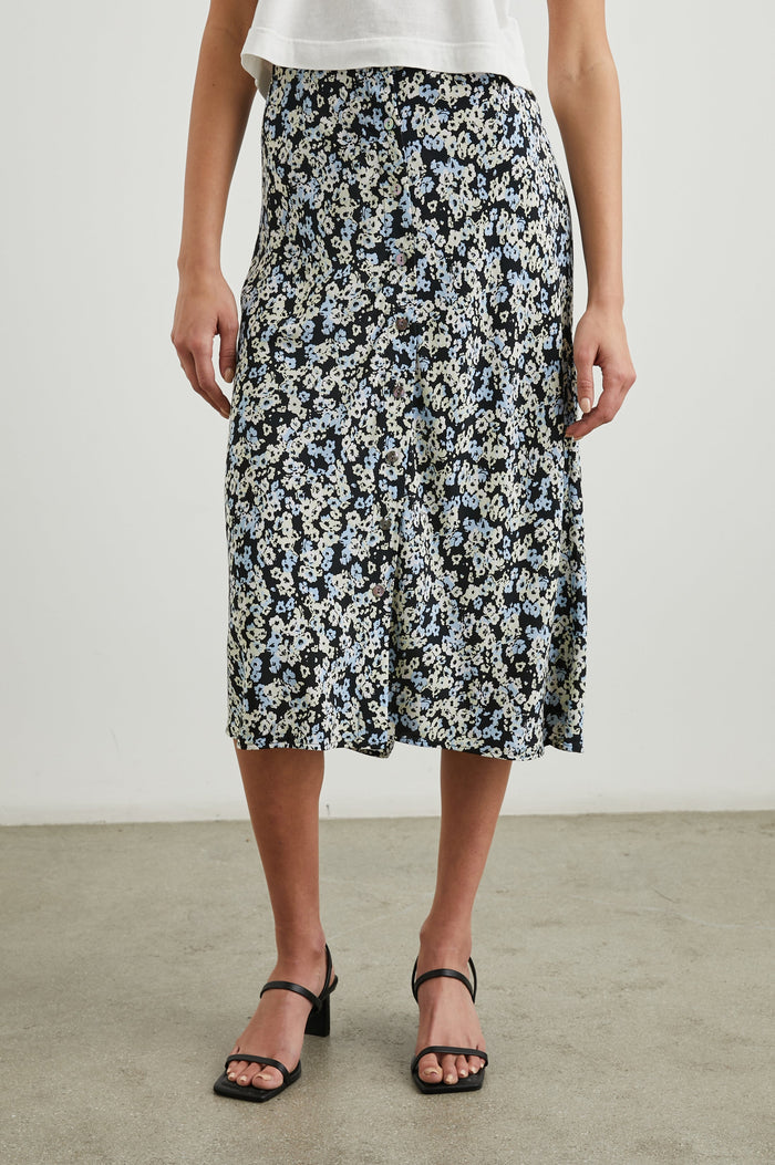 Rosetta Midi Skirt with Buttons Down the Front in Midnight Meadow Floral Colorway, blue and white flowers on Midnight - Front View Featured on Model