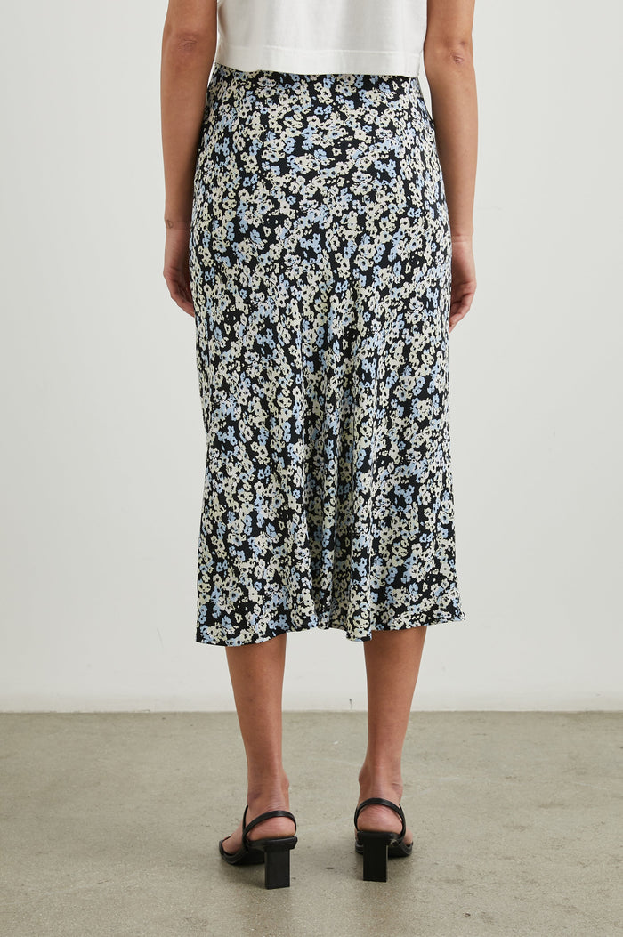 Rosetta Midi Skirt with Buttons Down the Front in Midnight Meadow Floral Colorway, blue and white flowers on Midnight - Back View Featured on Model